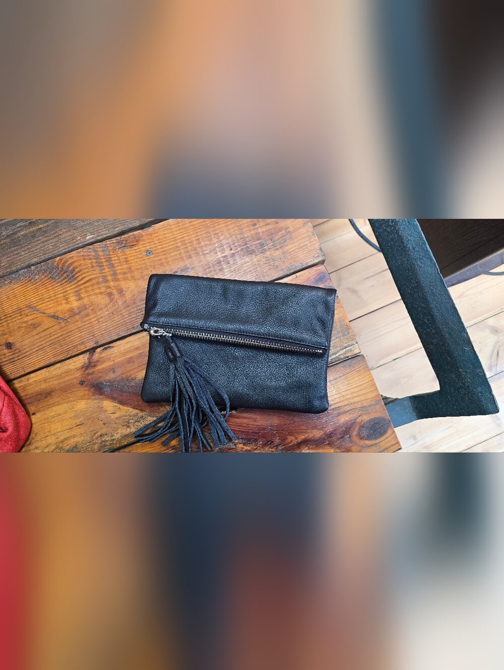 Roots Black Tassel Zip Clutch